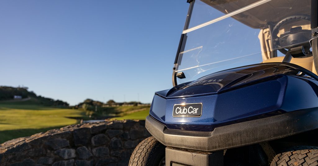Close-up photo of a blue Club Car Tempo showcasing the logo.