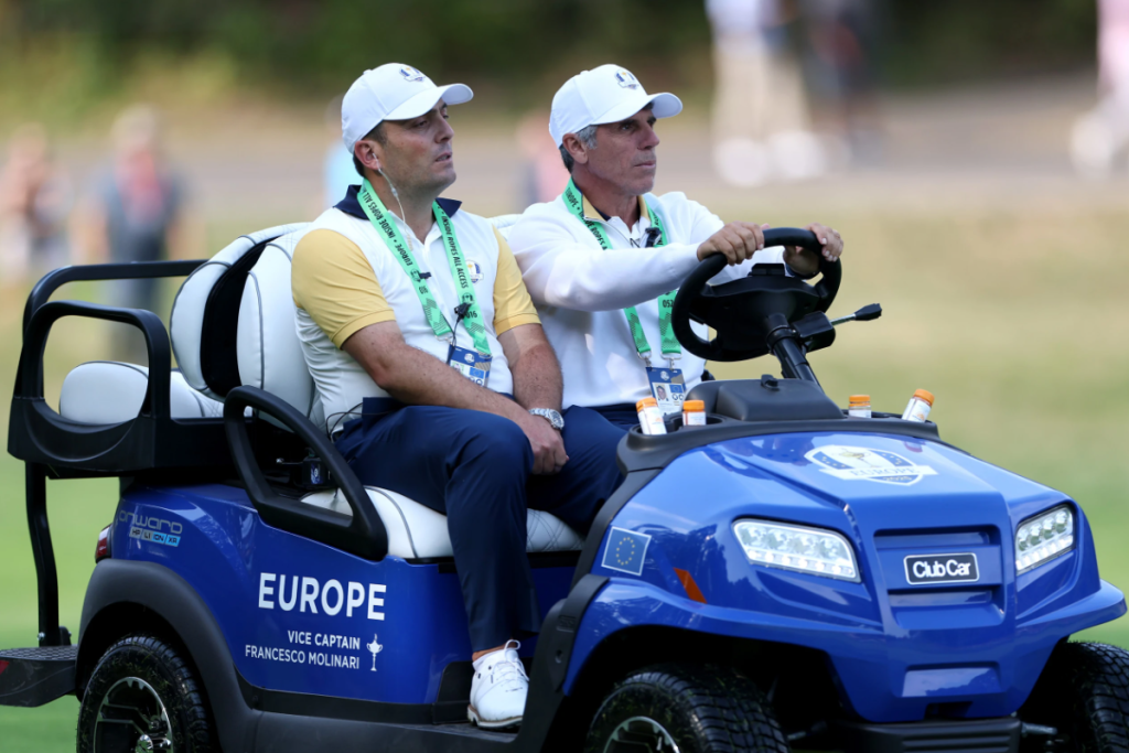 A photo of Vice Captain Francesco Molinari as he is driving around in a blue Club Car for Team Europe at the Ryder Cup