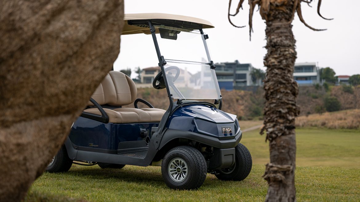Club Car golf cart parked on the fairway during routine service visit
