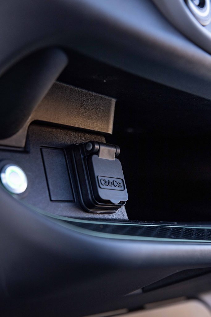 A photo of the Club Car Onward's Charging Port with the cap Closed