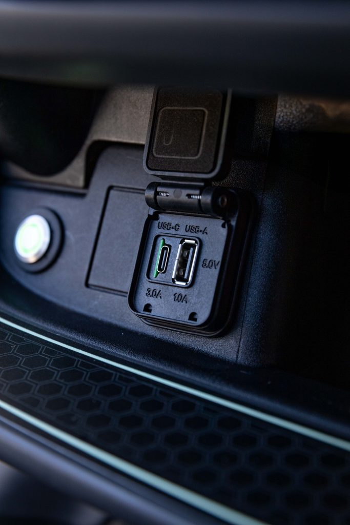 A photo of the Club Car Onward's Charging Port with the cap Open